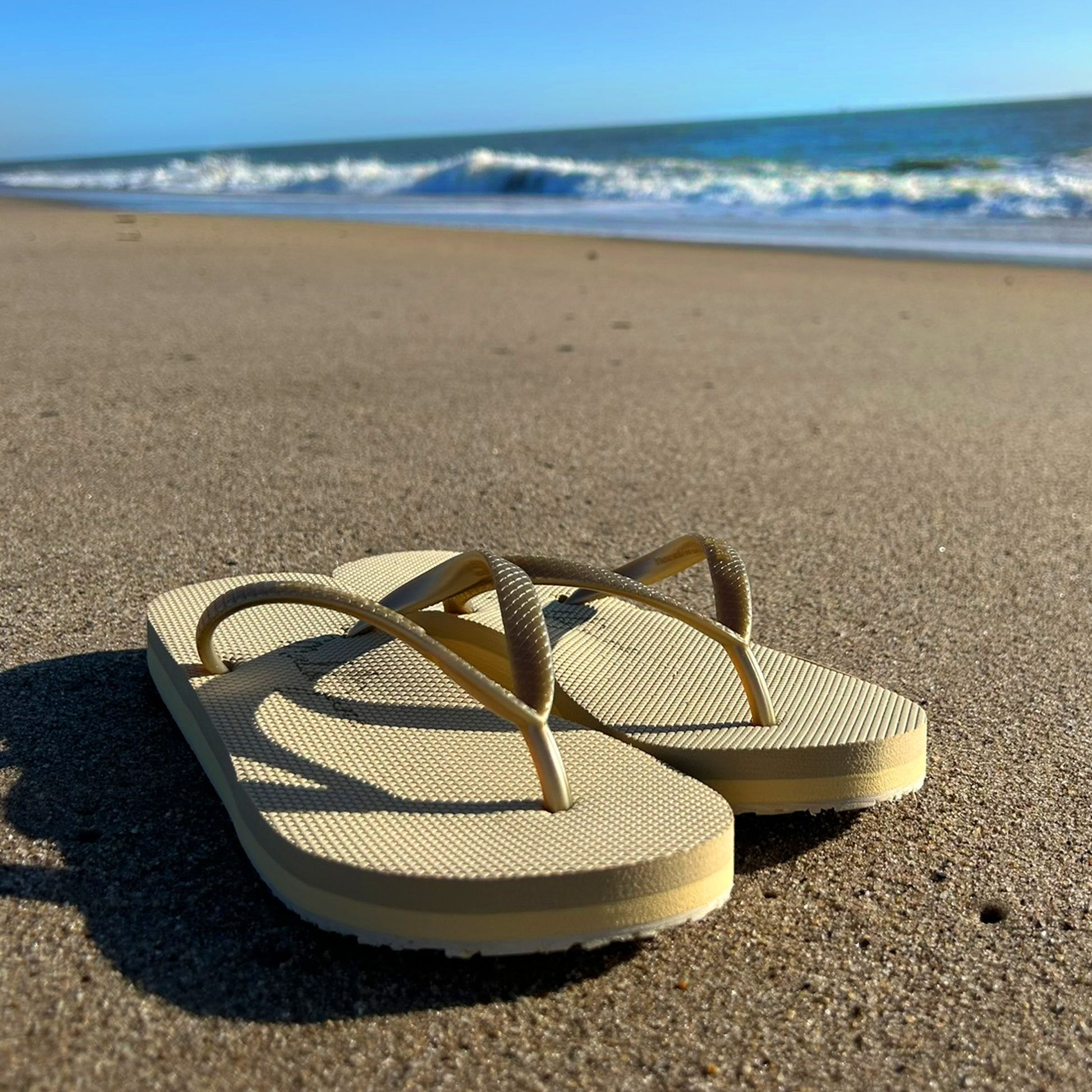 Malibu Jane gold flip flops feature 3 layer construction and arch support